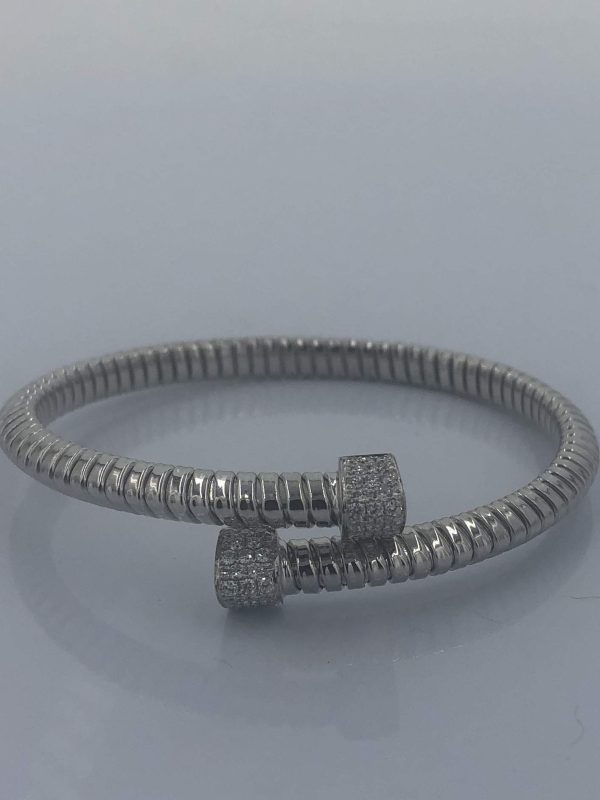 18K W/G LADIES DIAMOND BANGLE BRACELET. 10.44 DWT. 56 PTS. DIA.