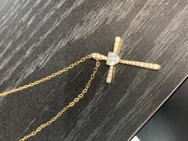 14K Y/G 16" CHAIN 10K Y/G CROSS PENDANT WITH HEART CZ AND SMALLER CZS SURROUNDING.