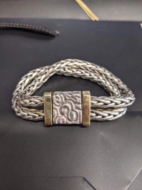14K AND STERLING SILVER BRACELET WEIGHING 79.1 GRAMS. 7.5 INCHES