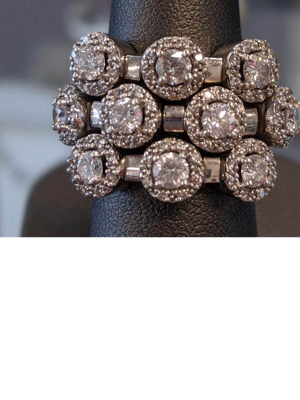 14K W/G Flex ring by Sonia B set with approximately 2.72 carats of G/H color, SI 1 clarity diamonds. WEIGHS 10.7 DWT.