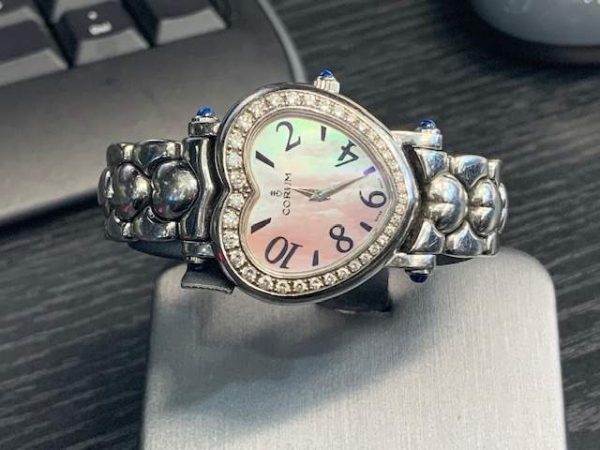LADIES CORUM WATCH WITH MOP DIAL AND DIAMOND BEZEL