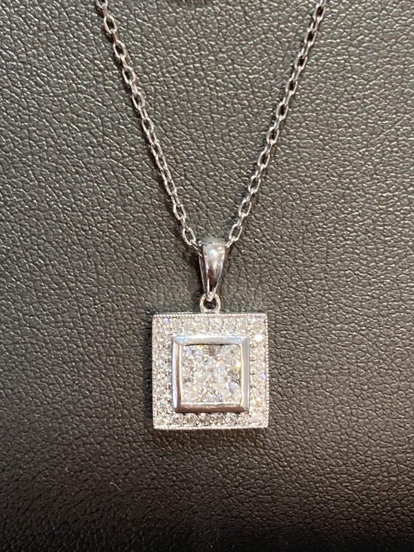 14K W/G LADIES DIAMOND SQUARE SHAPE PEDANT FEATURING .56 PTS OF ROUND BRILLIANT CUT DIAMONDS. 1.3 DWT. PENDANT IS ON A 14K W/G 16" CHAIN (1.0 DWT-CHAIN). 2.3 DWT TOTAL.