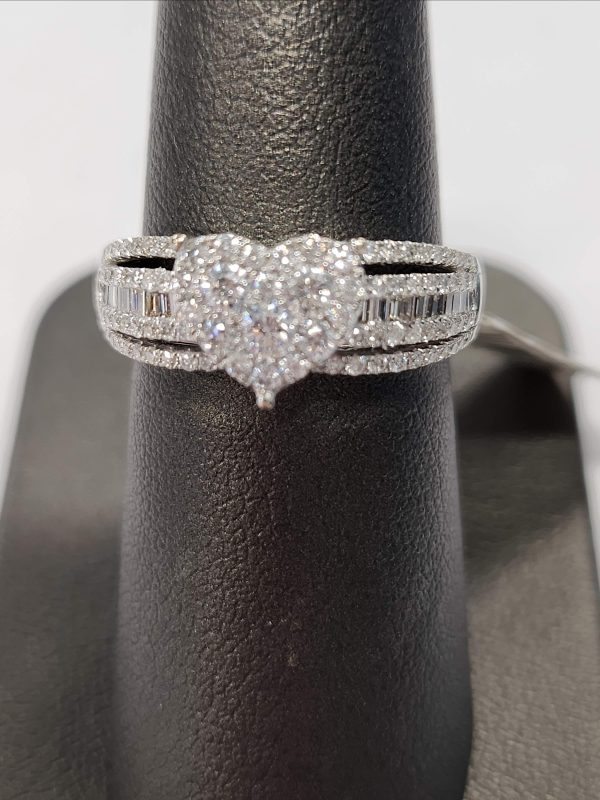 18K W/G DIAMOND HEART BAND WITH 0.71 PTS RBC'S AND 0.12 PTS OF BAGUETTES.0.83 PTS TCW. 2.1 DWT.