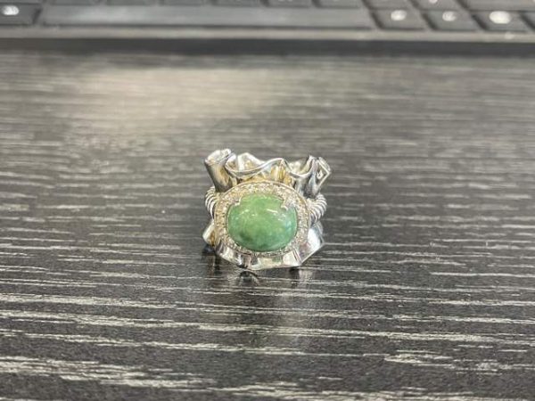 STERLING SILVER RING WITH 20 CZ'S & GREEN STONE