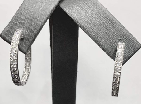 14K W/G LADIES DIAMOND INSIDE AND OUT ROUND HOOP EARRINGS FEATURING 1.36 CARATS OF PAVE SET ROUND BRILLIANT CUT DIAMONDS. LENGTH: 22MM & WIDTH: 4MM GOLD WEIGHT:3.6 DWT.