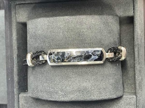 STERLING SILVER DAVID YURMAN BRACELET ON LEATHER STRAP.