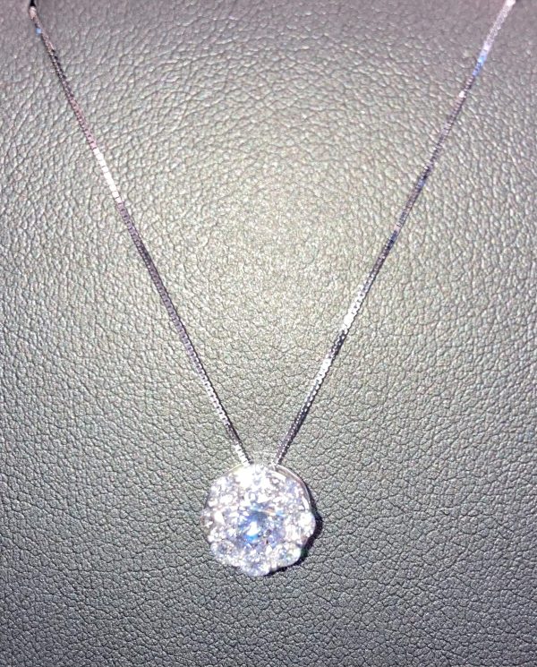 14K WHITE GOLD LAB GROWN DIAMOND HALO PENDANT WITH 1/2 CARAT CENTER ROUND WITH 8 RBC'S THAT MAKE UP A 1/2 CARAT HALO. 1.00 CARAT OF LAB GROWN DIAMONDS TOTAL. COLOR:G-H CLARITY:VS. IGI CERT #53J928742211.