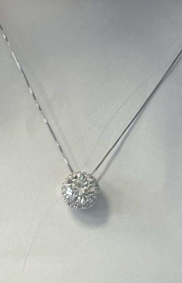 14K W/G LADIES LAB GROWN DIAMOND HALO NECKLACE FEATURING A CENTER RBC WEIGHING 1.46 CTS AND A HALO OF RBC'S WEIGHING 0.14 PTS WITH A TCW OF 1.62 CARATS. COLOR:G-H CLARITY:VS. WITH IGI CERT CARD. REPORT#54J075792211