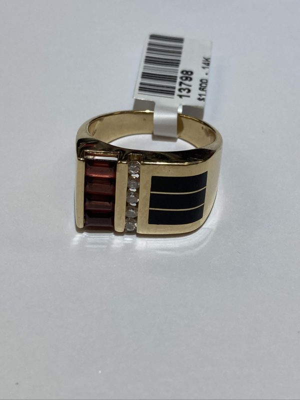 14K Y/G GENTS RING WITH ONYX, GARNET BAGUETTES AND ROUND BRILLIANT CUT DIAMONDS WEIGHING A TOTAL OF .20 PTS. GOLD WEIGHT 8.8 DWT.