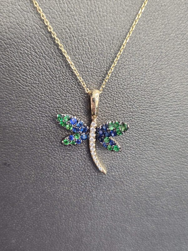 14K YG DRAGONFLY PENDANT. 14 SAPPHIRES .28CT, 11 DIAMONDS .05CT, 14 GREE GARNET .024 ON 18" CHAIN. 1.7DWT