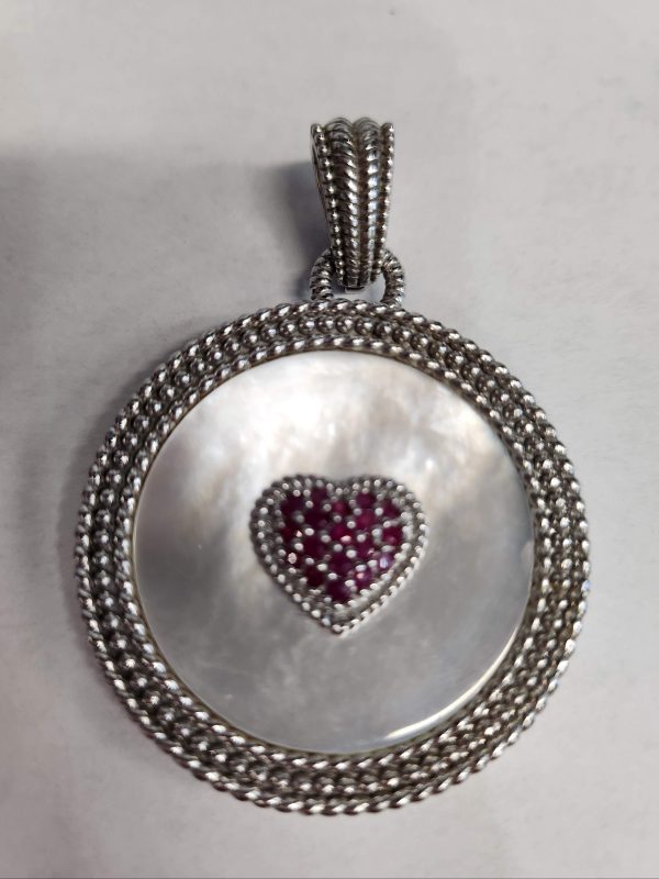 VINTAGE JUDITH RIPKA STERLING SILVER MILLGRAIN DETAILED REVERSIBLE ENHANCER PENDANT WITH MOTHER OF PEARL AND APPROXIMATELY .50CT RUBY HEART. 30.3G.