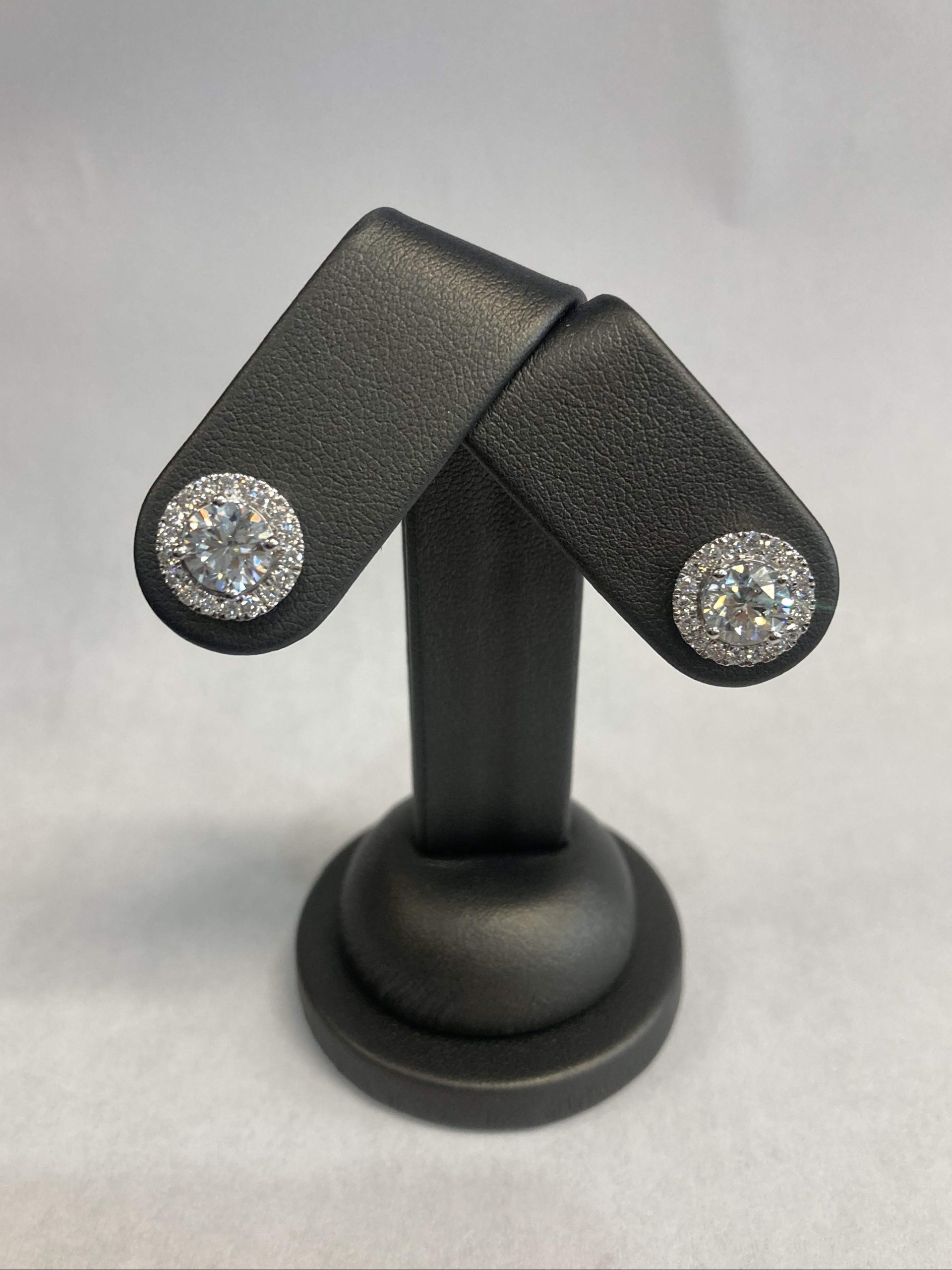 14K WHITE GOLD HALO STUDS EARRINGS W/ 38 ROUND BRILLIANT WEIGHING APPROX. 3.12 CTS COLOR: G-H CLARITY: VS1-VS2. DIS# 518374 COMES WITH CARD AND POUCH.