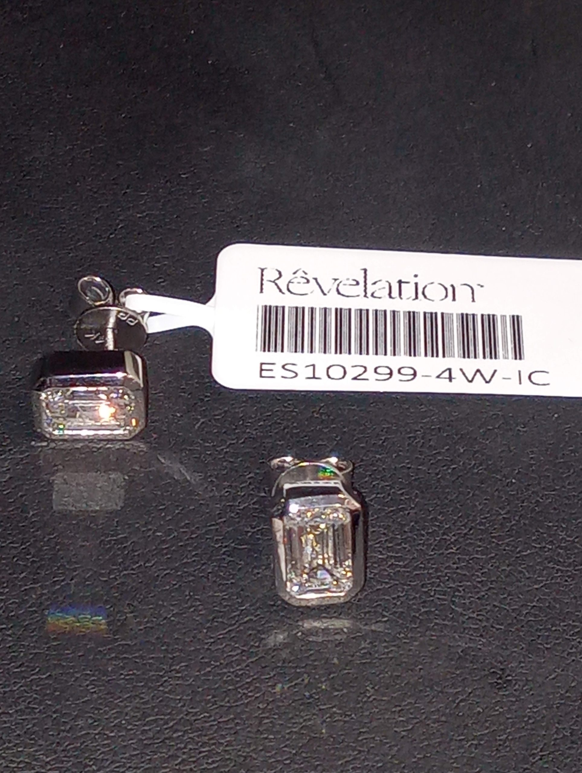 14K WHITE GOLD BEZEL SOL STUD EARRINGS CONTAINING EMERALD CUT 1.97 CTS, COLOR: F-G, CLARITY: VS, 1.9 DWT, IGI# 32J657292405 COMES W/ CERT CARD