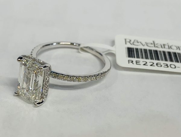 14K WHITE GOLD ENGAGEMENT RING CONTAINING 39 LAB GROWN DIAMONDS W/ A HIDDEN HALO, CENTER STONE IS AN EMERALD WEIGHING APPROX 3.01 CTS COLOR: F CLARITY: VS, SIDE STONES 0.26 CT COLOR: E-F CLARITY: VS, 3.27 TCW, 2.1 DWT, COMES W/ IGI CARD, IGI# 36J702302405