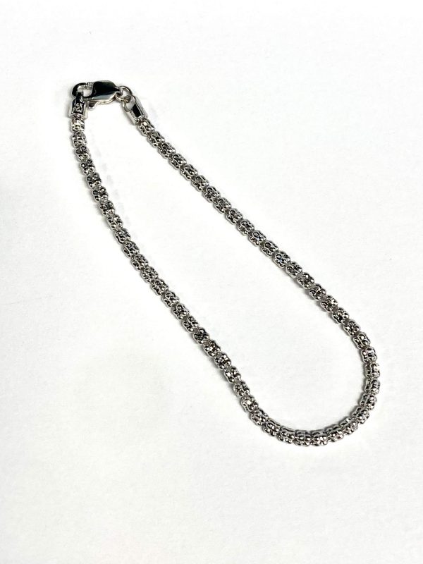 7" 14K WHITE GOLD TRAVEL TENNIS BRACELET. 4.0G