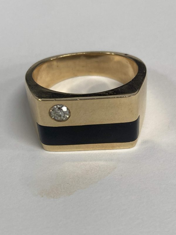 14K Y/G SQUARED GENTS RING FEATURING A 0.20 PT ROUND BRILLIANT CUT WITH BLACK ONYX INLAY. 15.6 DWT